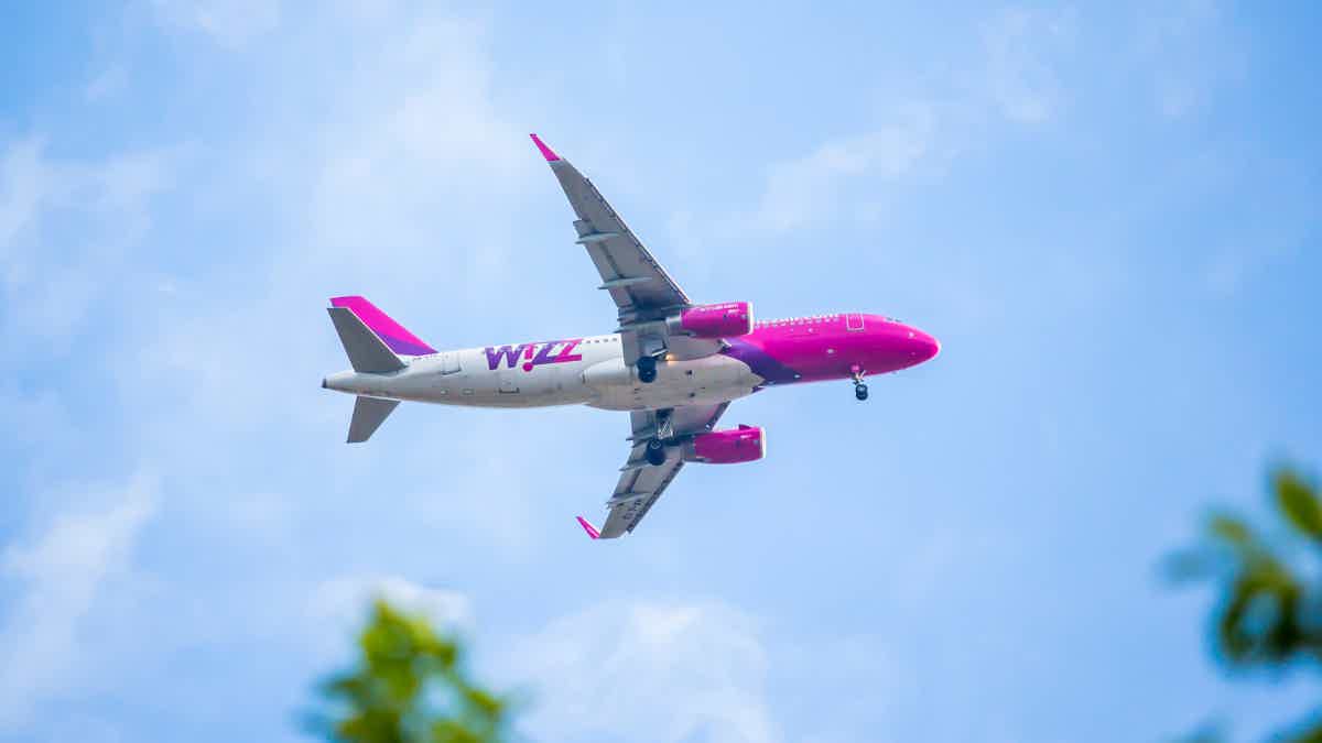 You can be in one of these fun-colored airplanes flying with Wizz Air. Source: Adobe Stock.