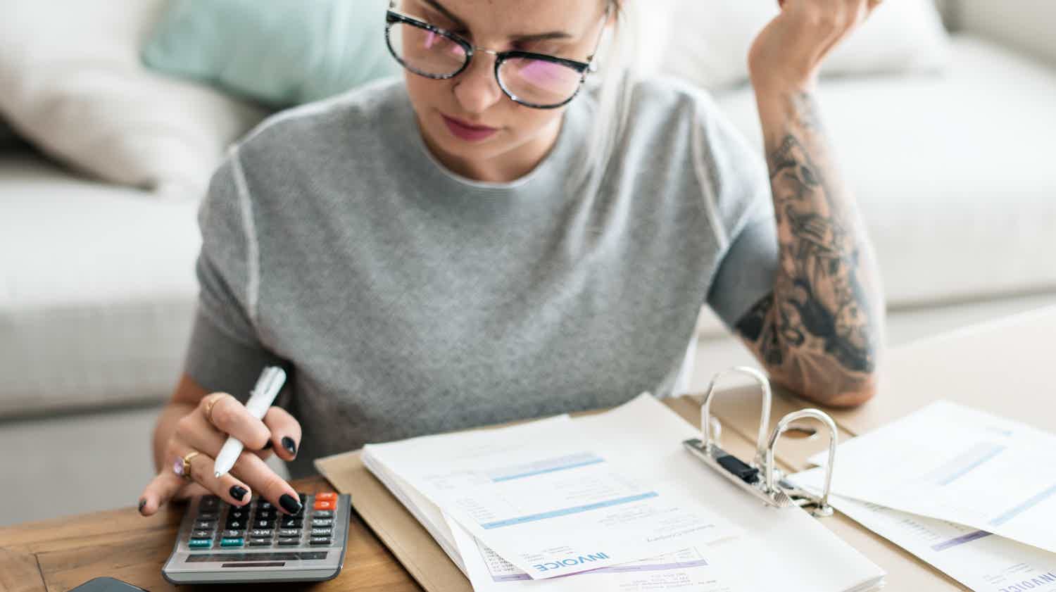 woman making budget to get personal loans