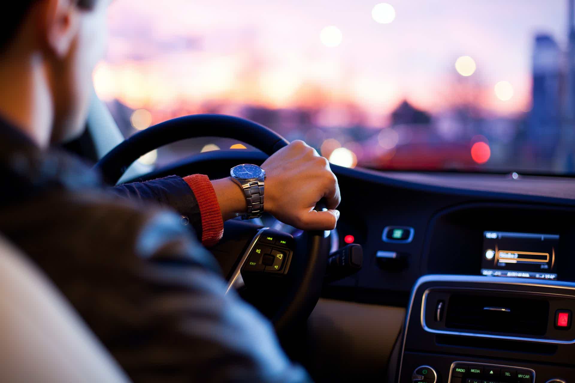 zoom of a person driving a car