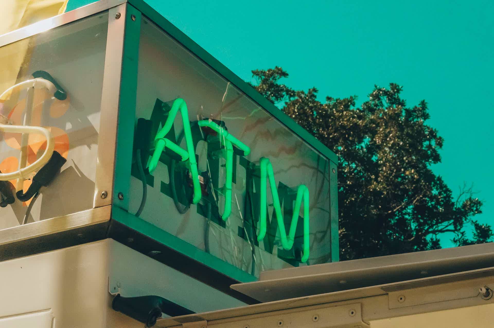 Outdoor sign with the word ATM