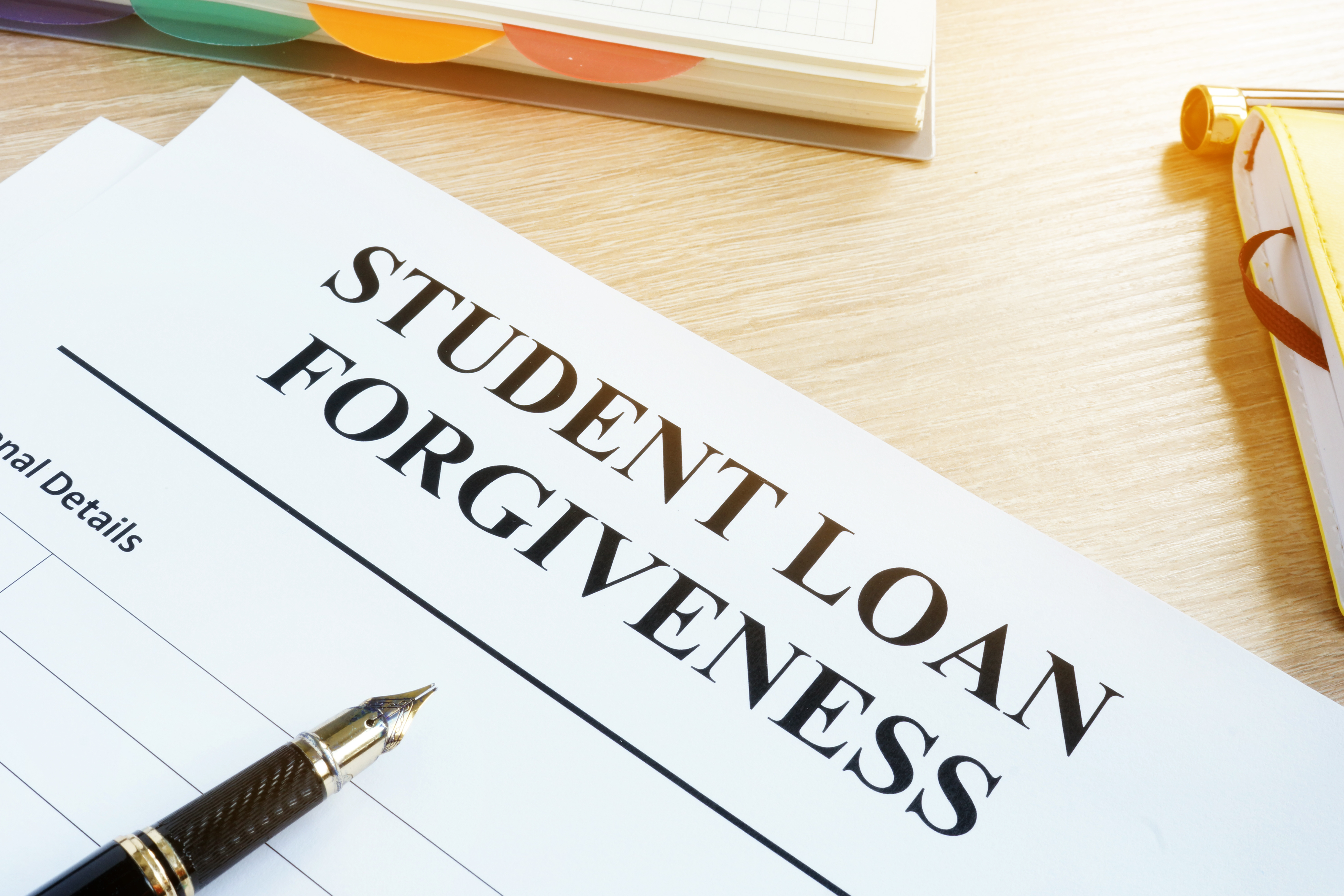 Learn everything about student loan forgiveness and check if you qualify for it! Source: Adobe Stock.