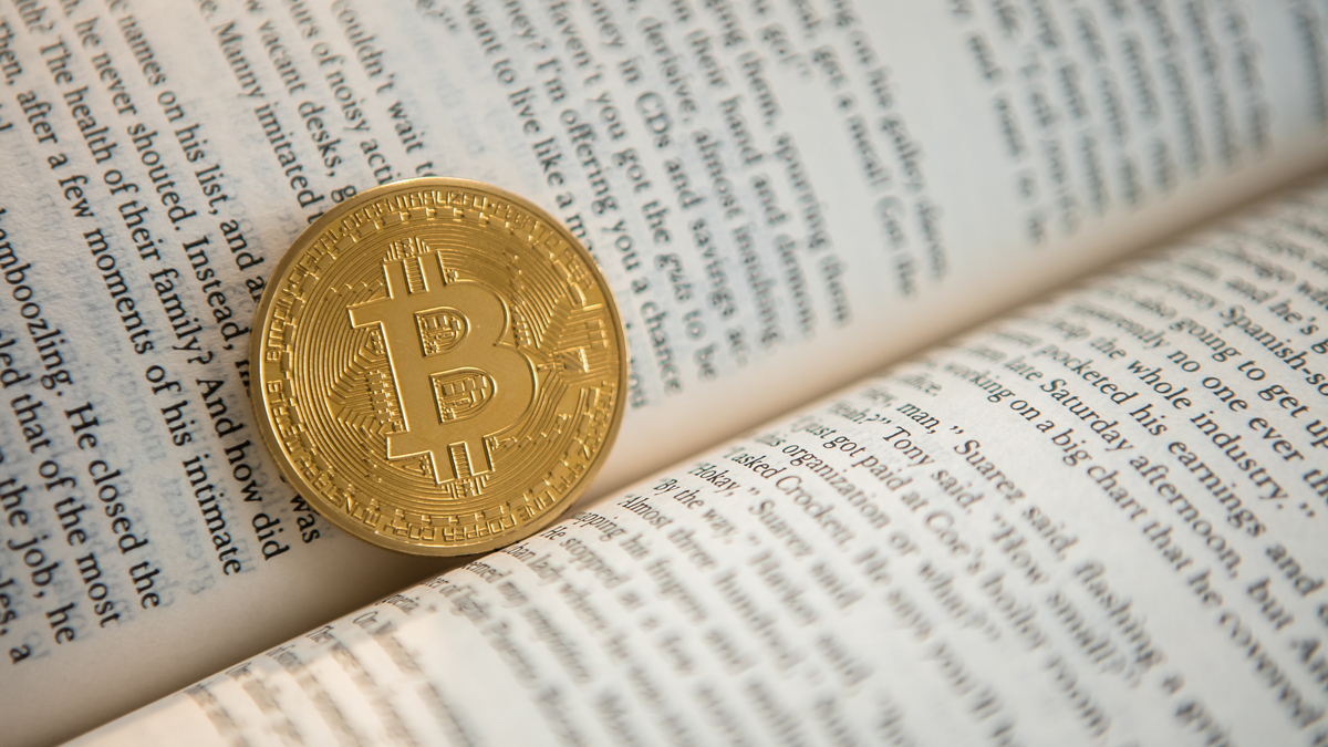 See which books you should read before investing in crypto. Source: Unsplash. 