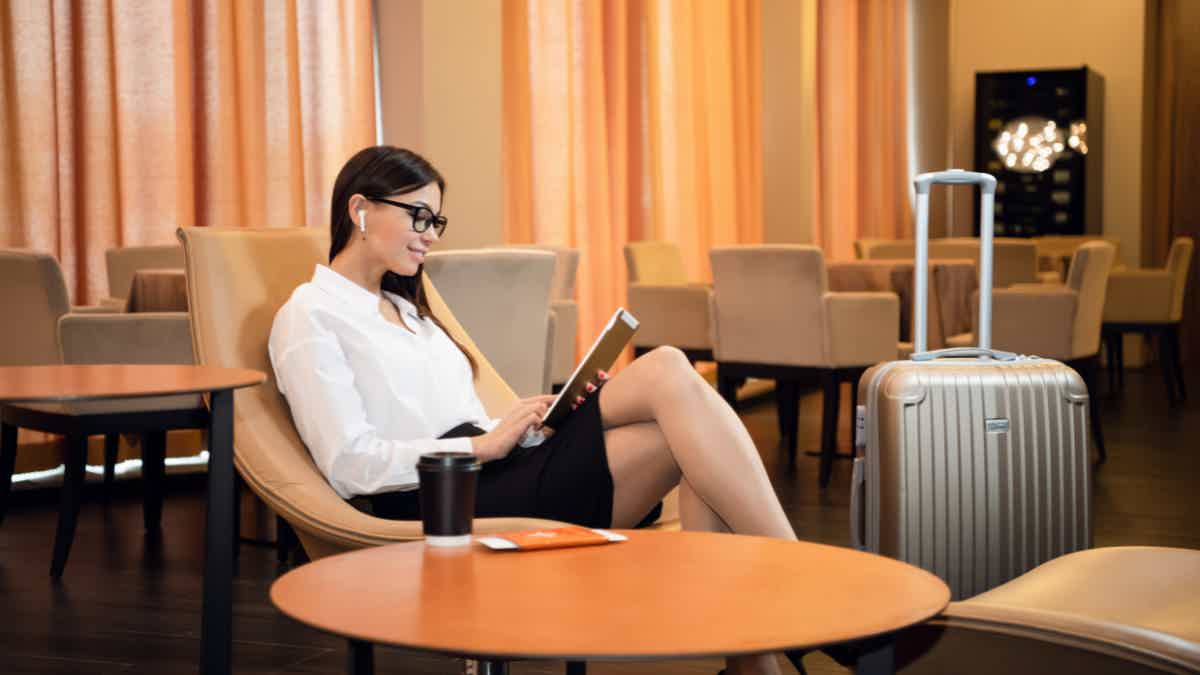 Wait for your flight in the comfort of an airport lounge. Source: Adobe Stock.