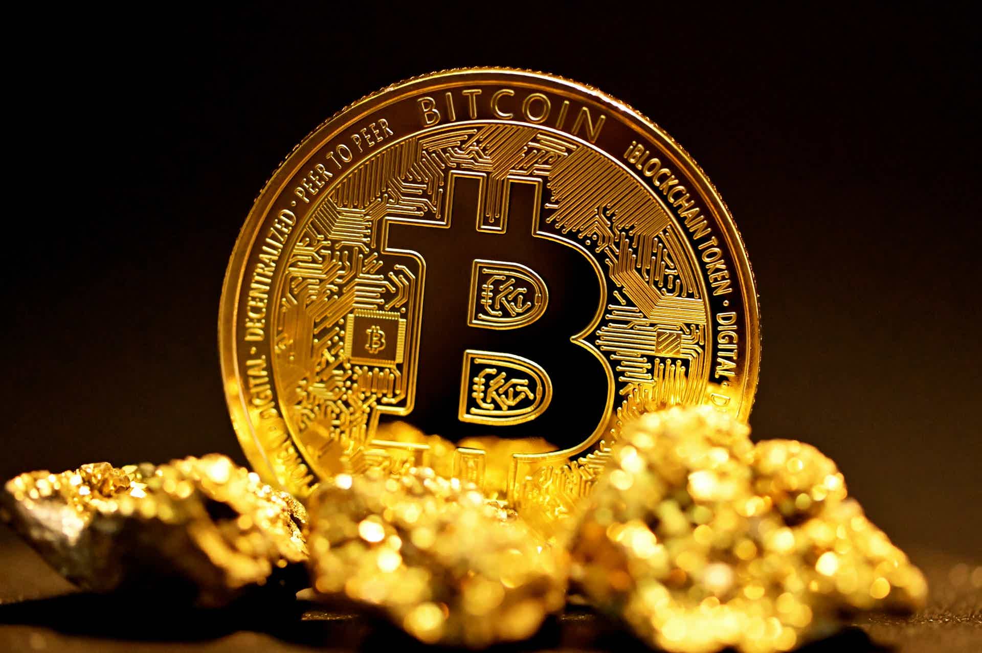 Physical representation of a Bitcoin with gold pieces around it