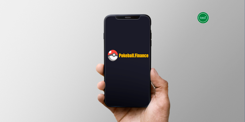 hand holding a smartphone with Pokeball Finance's logo on the screen