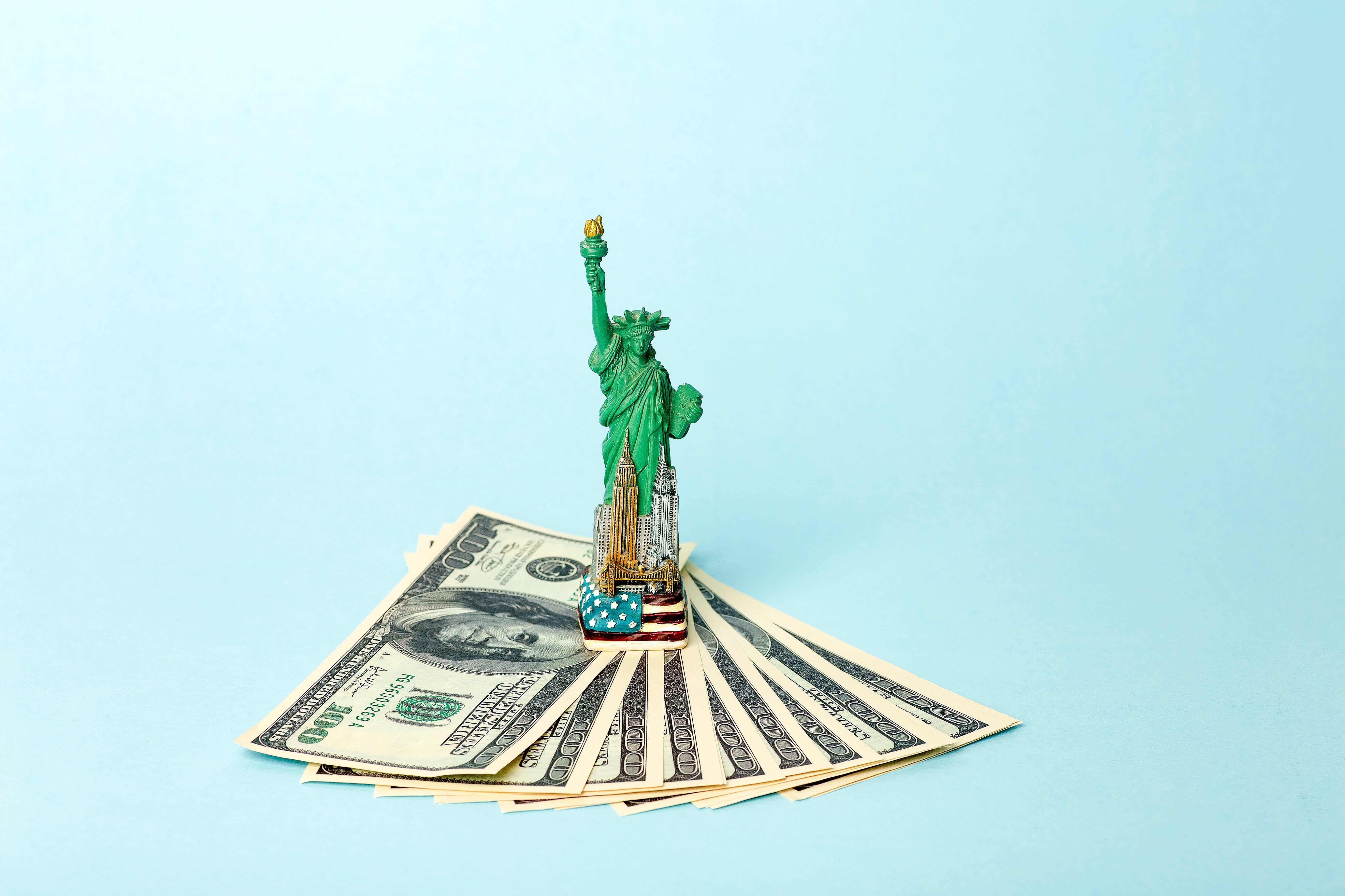 statue of liberty miniature on dollar bills